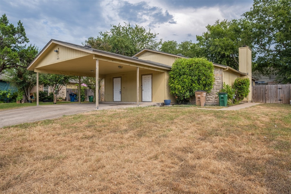 12901 Chromite Street, Unit B Austin, TX 78727 - Photo 21 of 21 View of front of property with concrete driveway and an attached carport