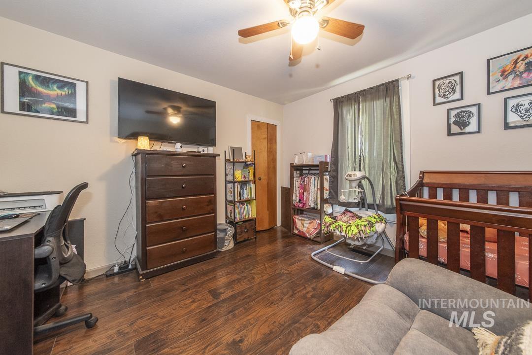 486 West Main Street South Vale, OR 97918 - Photo 23 of 37 Room featuring wood-finish flooring, a ceiling fan with integrated lighting, and neutral wall tones