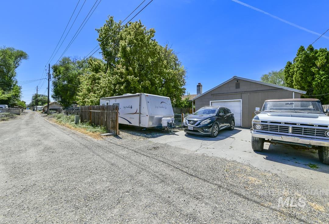 486 West Main Street South Vale, OR 97918 - Photo 27 of 37 Rear detached garage with two white garage doors and a paved driveway