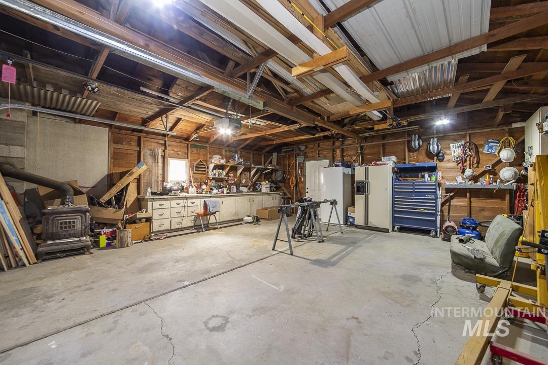 486 West Main Street South Vale, OR 97918 - Photo 30 of 37 Spacious garage with concrete flooring and exposed wood beam ceiling