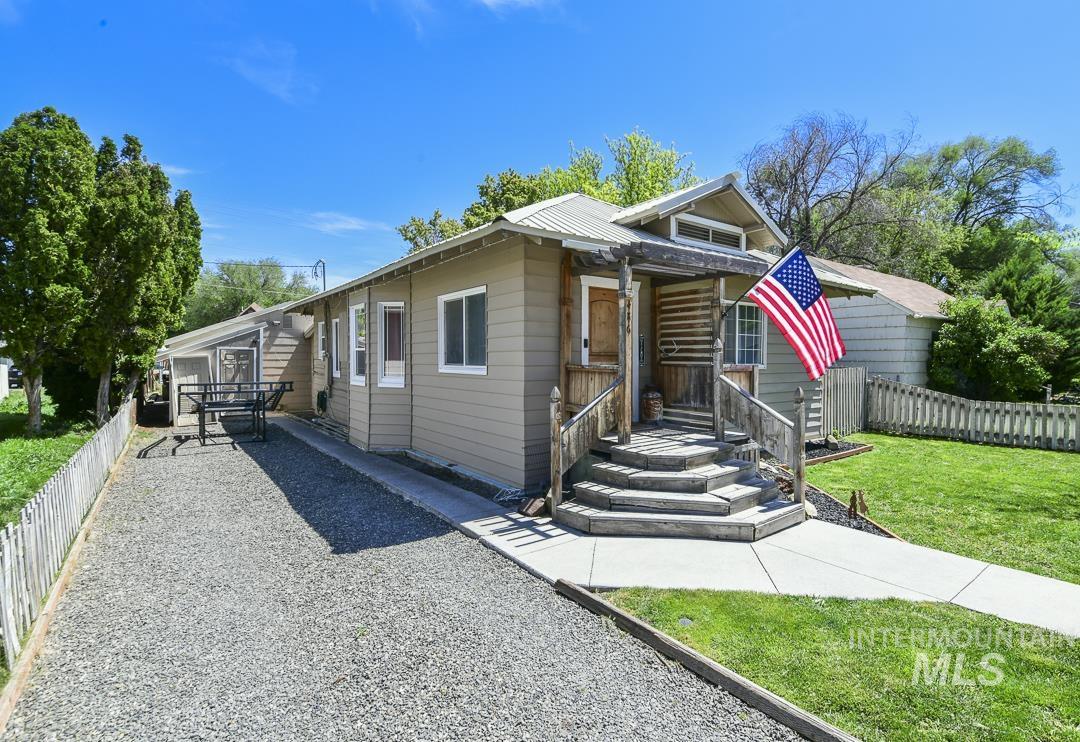 486 West Main Street South Vale, OR 97918 - Photo 3 of 37 Exterior featuring a covered front porch with log accents, wood steps, and railings