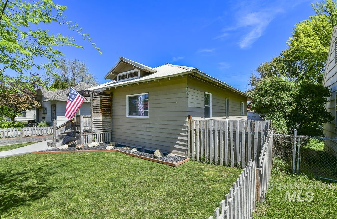 486 West Main Street South Vale, OR 97918 - Photo 33 of 37 Single-story residence featuring horizontal siding, a gabled roofline with a metal roof, and a covered porch entry