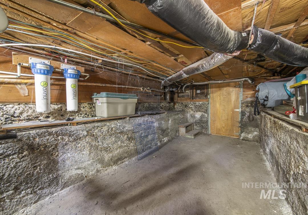 486 West Main Street South Vale, OR 97918 - Photo 37 of 37 Utility space featuring exposed wood joists, rigid ductwork, and a filtration system