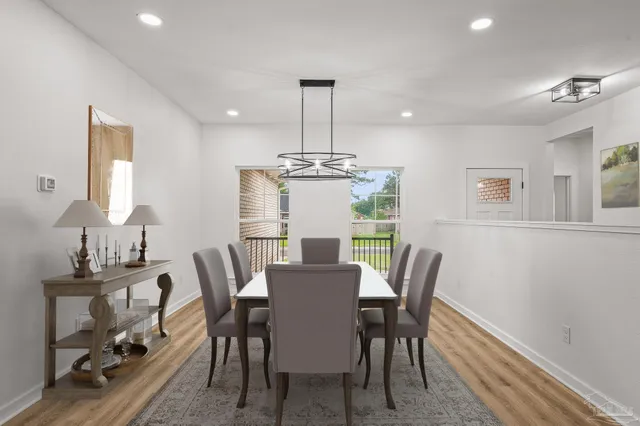a view of empty room with wooden floor and ceiling fan