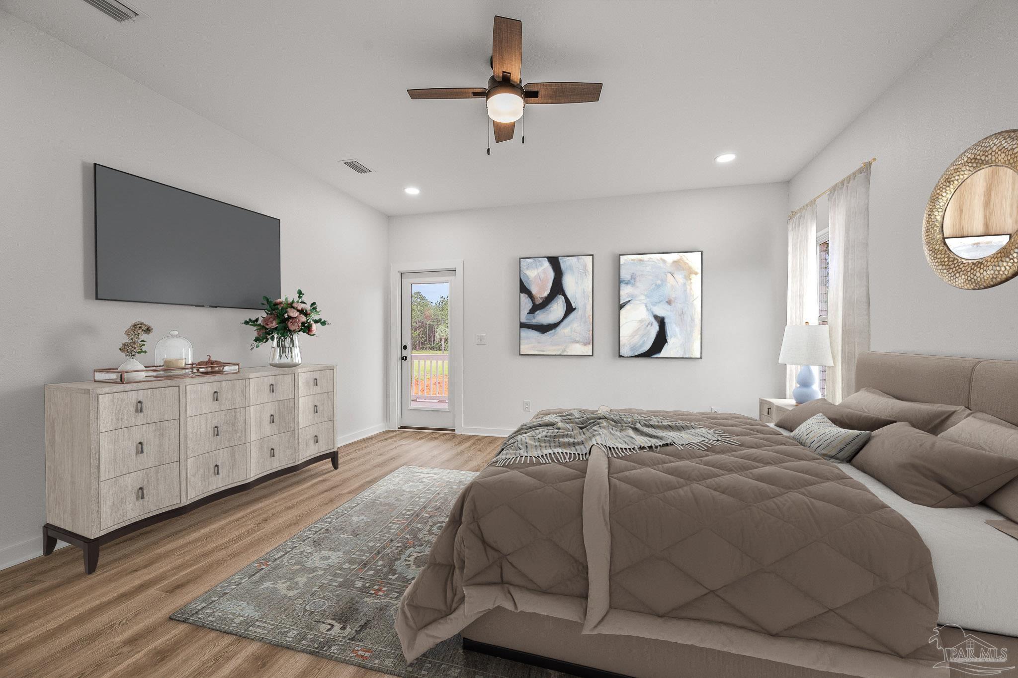 1192 Adrian Way Milton, FL 32583 - Photo 19 of 37 a bedroom with a large bed and a flat tv screen on dresser