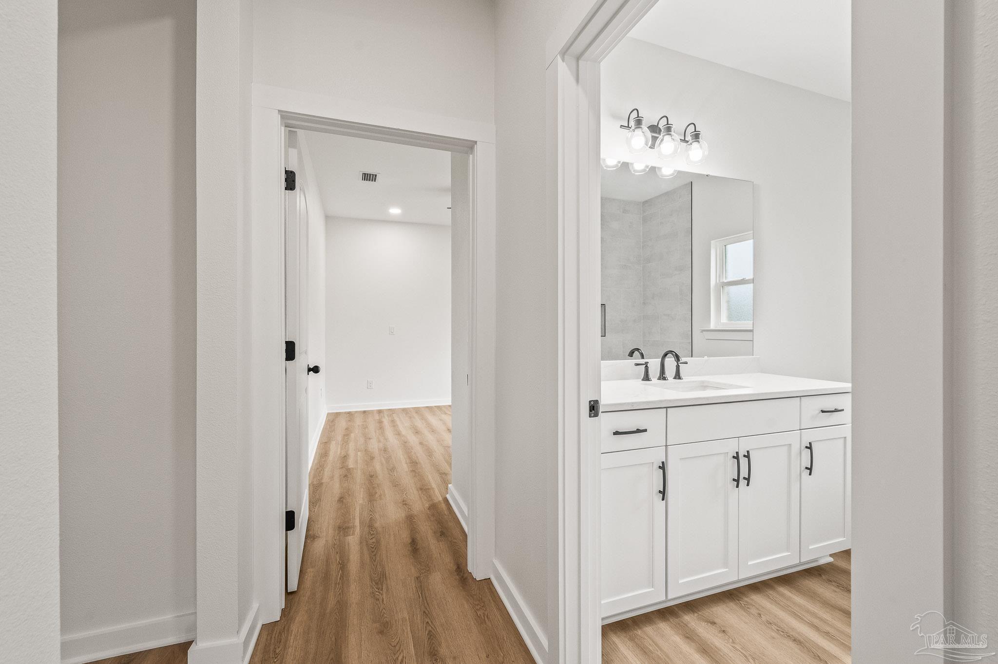 1192 Adrian Way Milton, FL 32583 - Photo 28 of 37 a view of bathroom with dual sinks