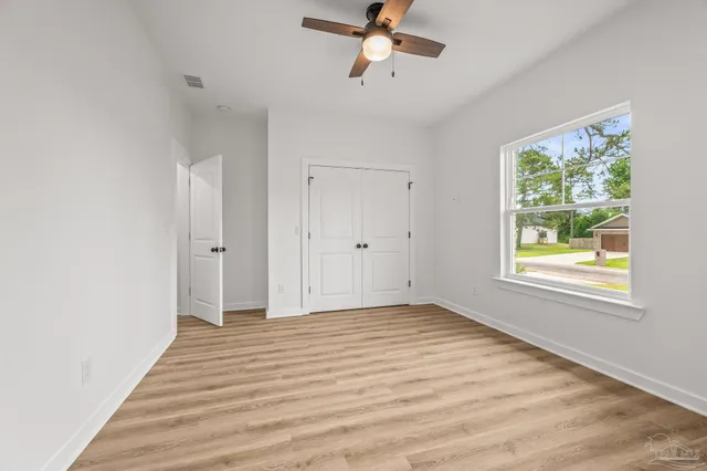 a view of a lake with a yard