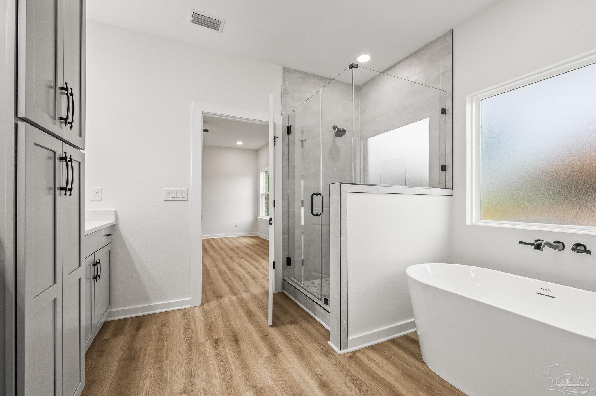 1192 Adrian Way Milton, FL 32583 - Photo 4 of 37 a bathroom with a tub shower and sink