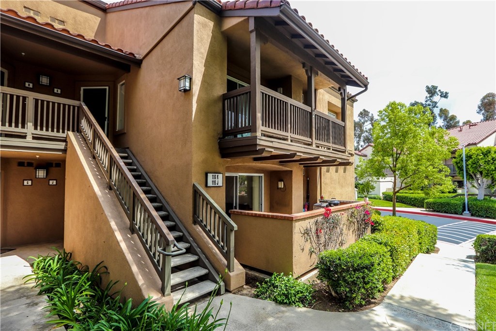 116 North Mine Canyon Road, Unit J Orange, CA 92869 - Photo 1 of 1 a front view of a house with plants and entryway
