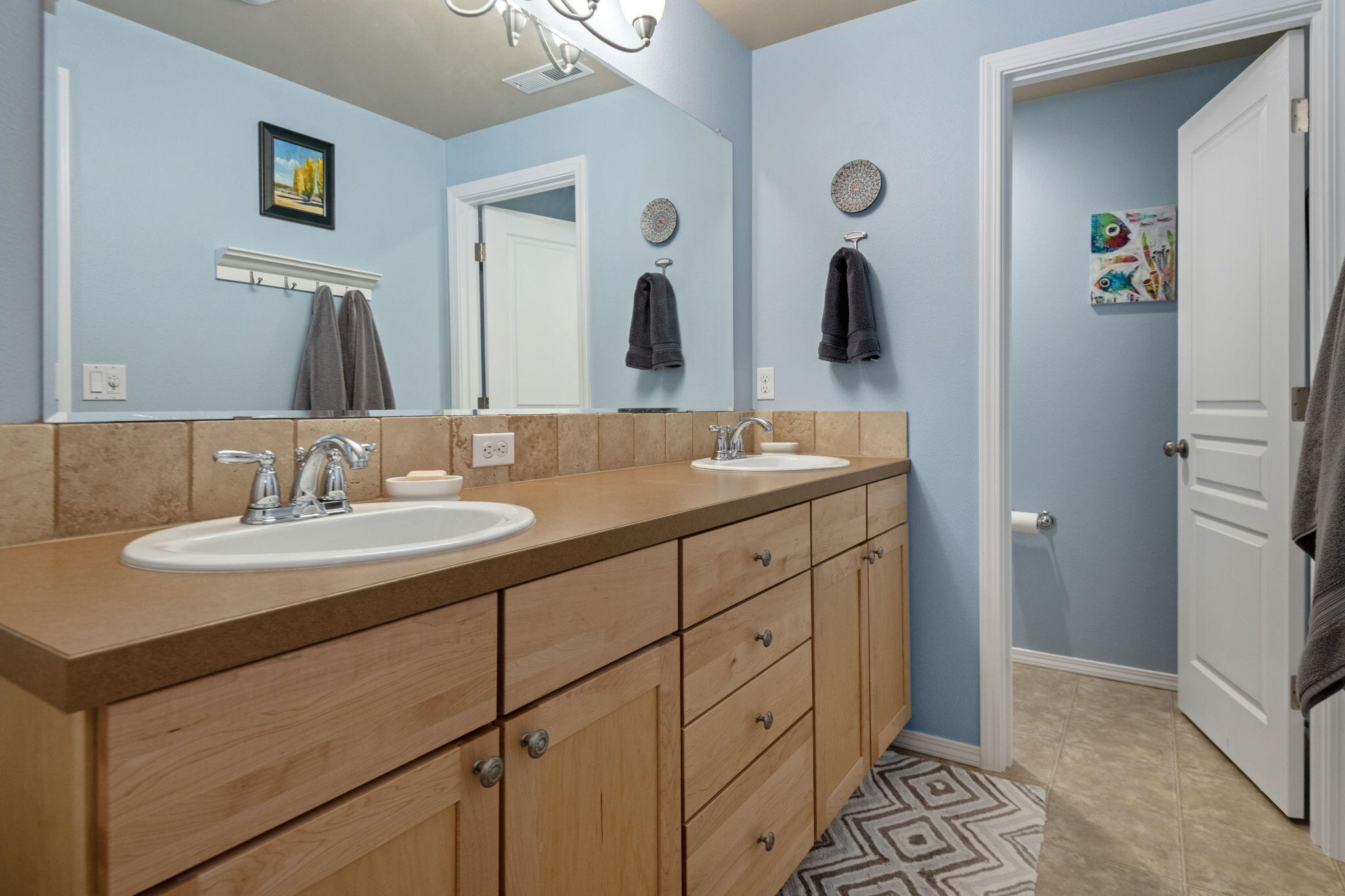 720 North Hindeman Street Sisters, OR 97759 - Photo 13 of 25 a bathroom with double vanity sinks and a mirror