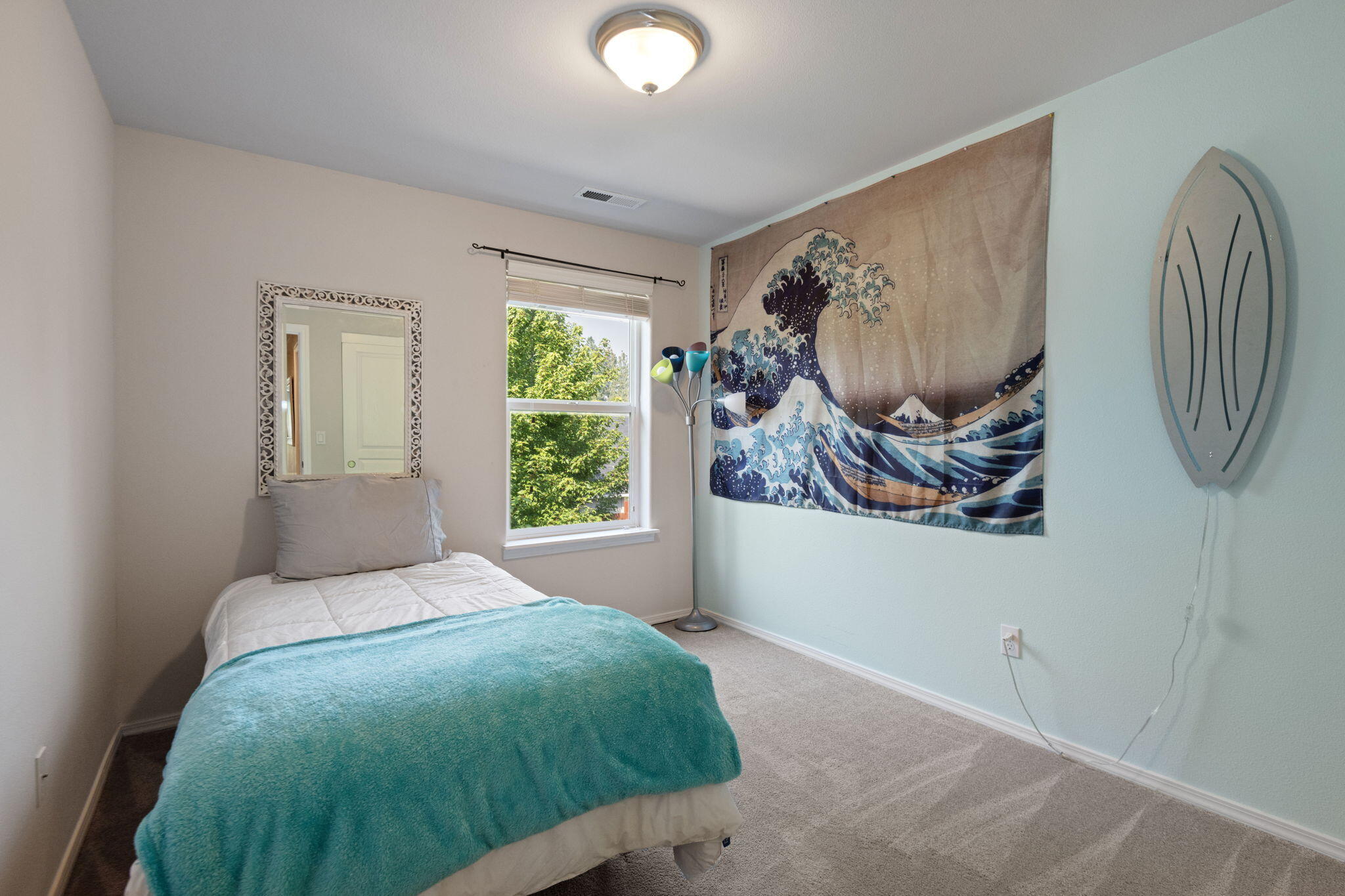 720 North Hindeman Street Sisters, OR 97759 - Photo 16 of 25 a bedroom with a large bed and a window