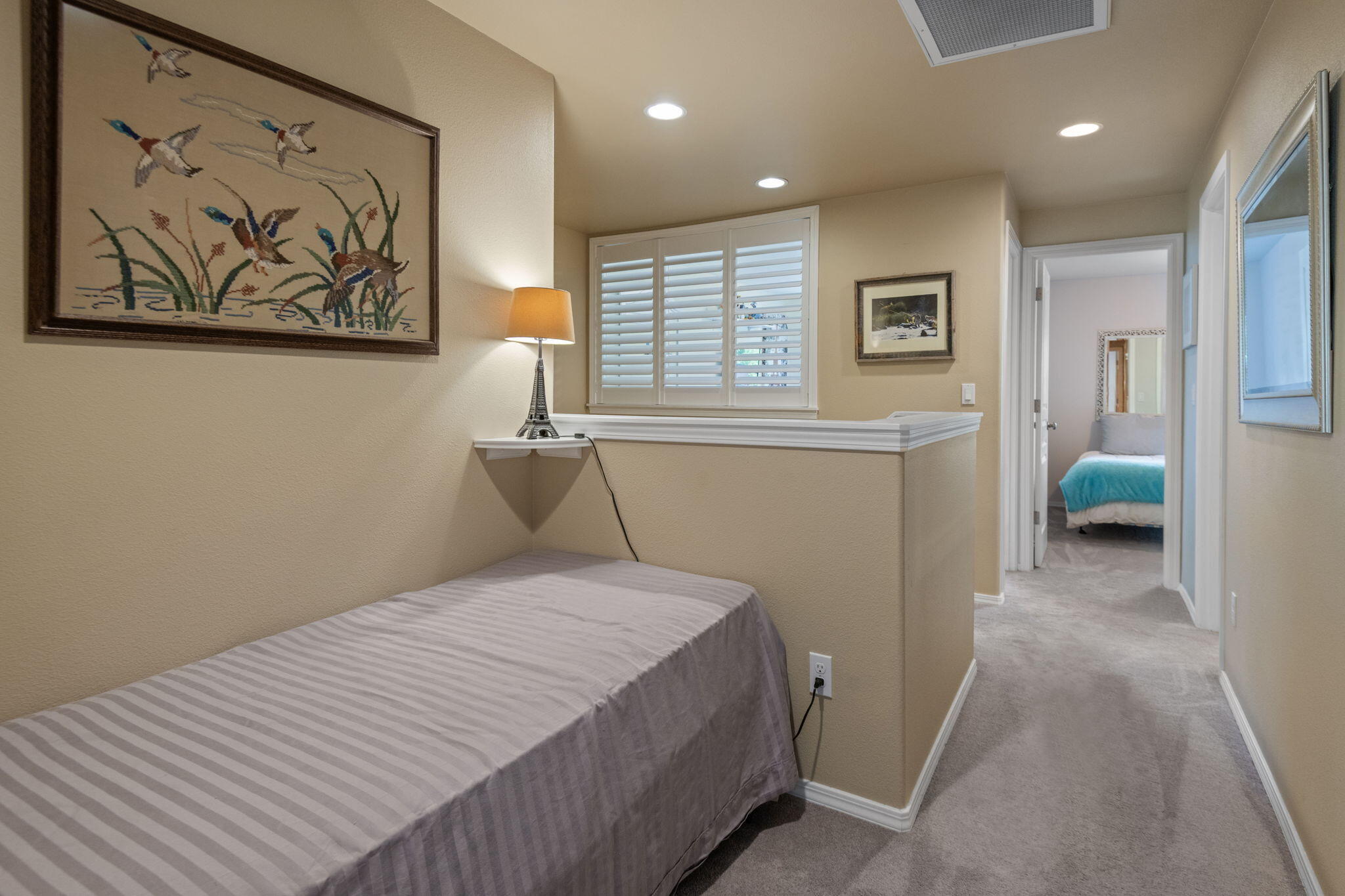 720 North Hindeman Street Sisters, OR 97759 - Photo 17 of 25 a bedroom with a bed and a painting on the wall
