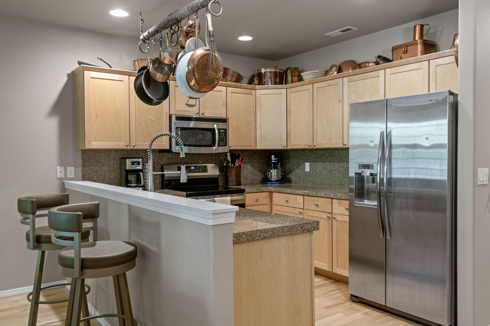 720 North Hindeman Street Sisters, OR 97759 - Photo 3 of 25 a kitchen with a refrigerator and a sink