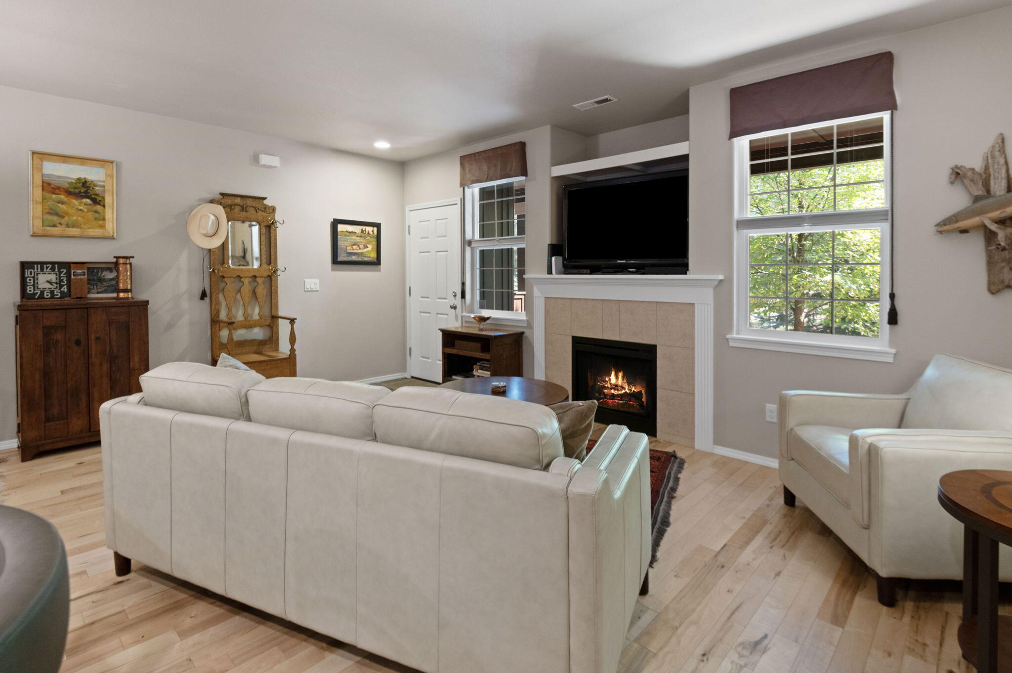 720 North Hindeman Street Sisters, OR 97759 - Photo 4 of 25 a living room with furniture a flat screen tv and a fireplace