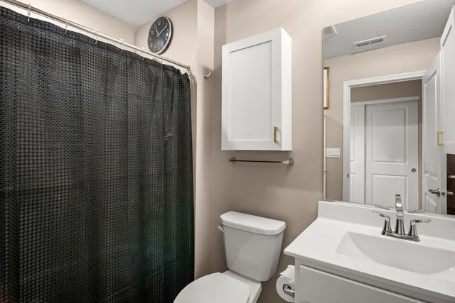 a view of a patio with a dining table and chairs with wooden fence