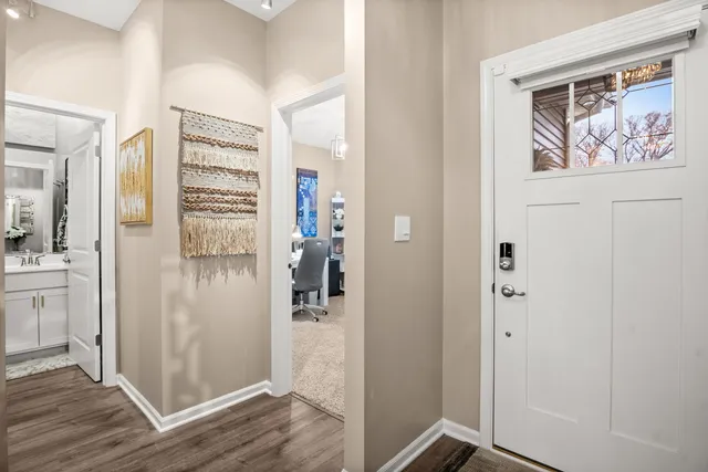 a view of walk in closet with wooden floor