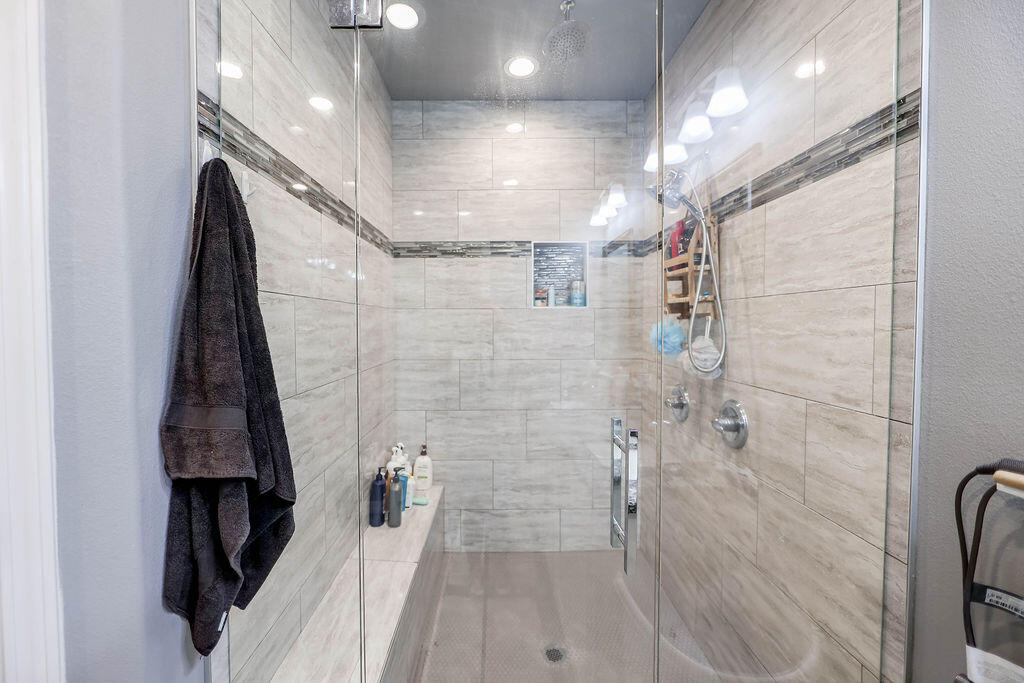 7101 22nd Place Lubbock, TX 79407 - Photo 13 of 24 a bathroom with a shower