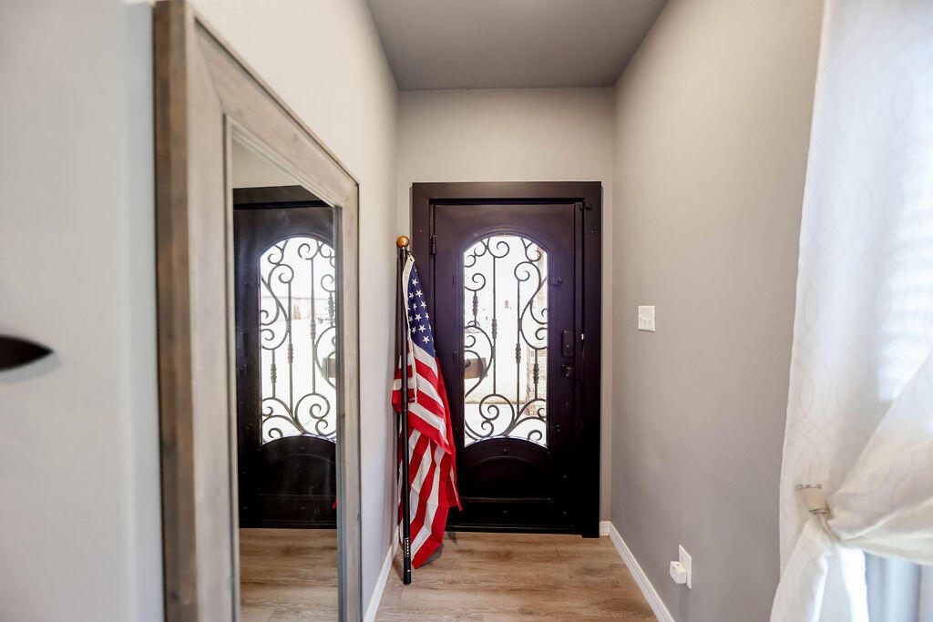 7101 22nd Place Lubbock, TX 79407 - Photo 2 of 24 a view of entryway with hallway and front door