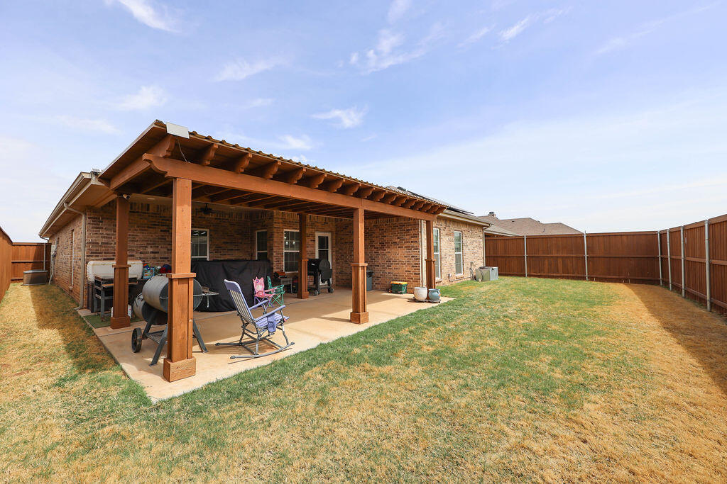 7101 22nd Place Lubbock, TX 79407 - Photo 23 of 24 a view of a house with backyard porch and sitting area