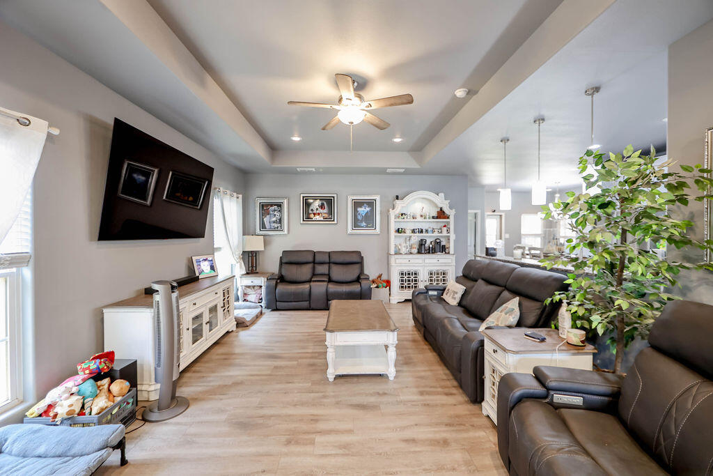 7101 22nd Place Lubbock, TX 79407 - Photo 3 of 24 a living room with furniture and a flat screen tv