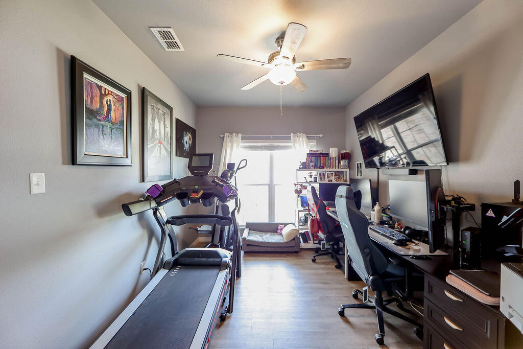 7101 22nd Place Lubbock, TX 79407 - Photo 5 of 24 a view of a room with gym equipment