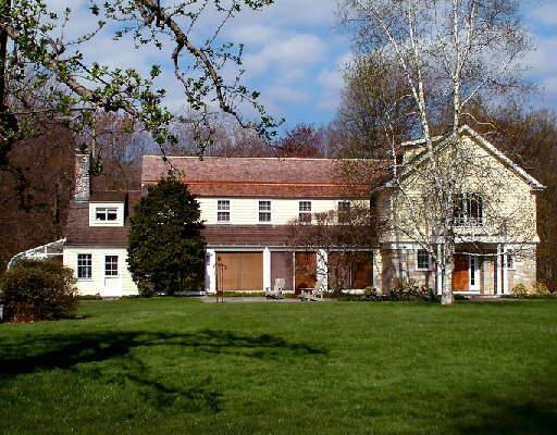 42 Old Mill Road Greenwich, CT 06831 - Photo 1 of 1 a front view of a house with a yard