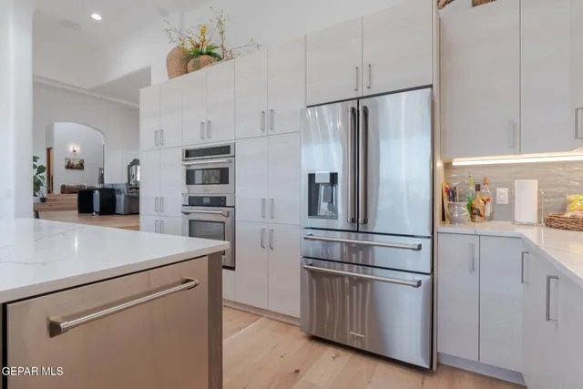 a bathroom with a sink and mirror with toilet