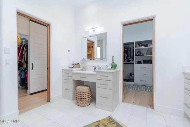 a bedroom with a bed and a lamp