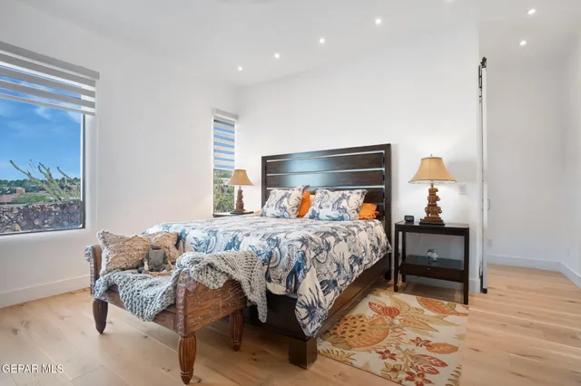 a bedroom with a bed and a table