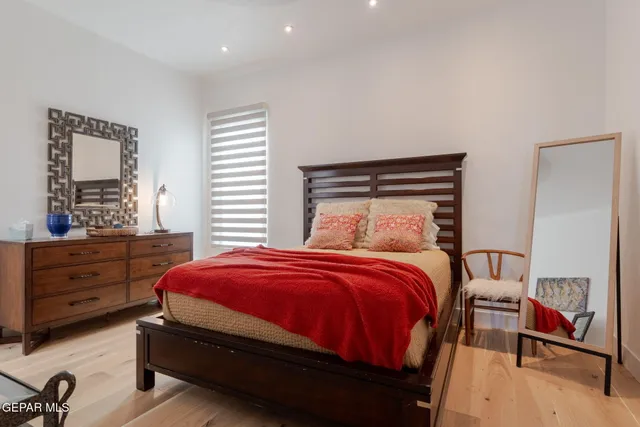 a view of a house with a swimming pool and sitting area