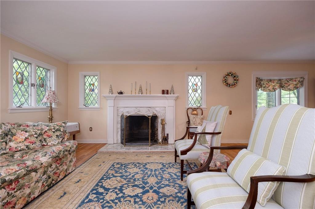 100 Cascade Road Pittsburgh, PA 15221 - Photo 4 of 30 The sunken livingroom has hardwood flooring and a beautiful wood burning fireplace.