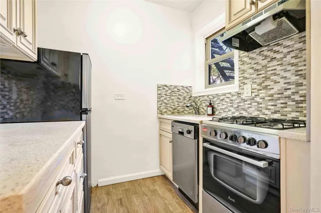 a kitchen with a stove and a microwave