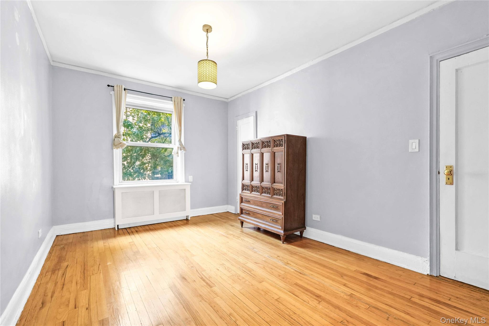 48-50 44th Street, Unit 4E Queens, NY 11377 - Photo 8 of 13 a view of an empty room with a window