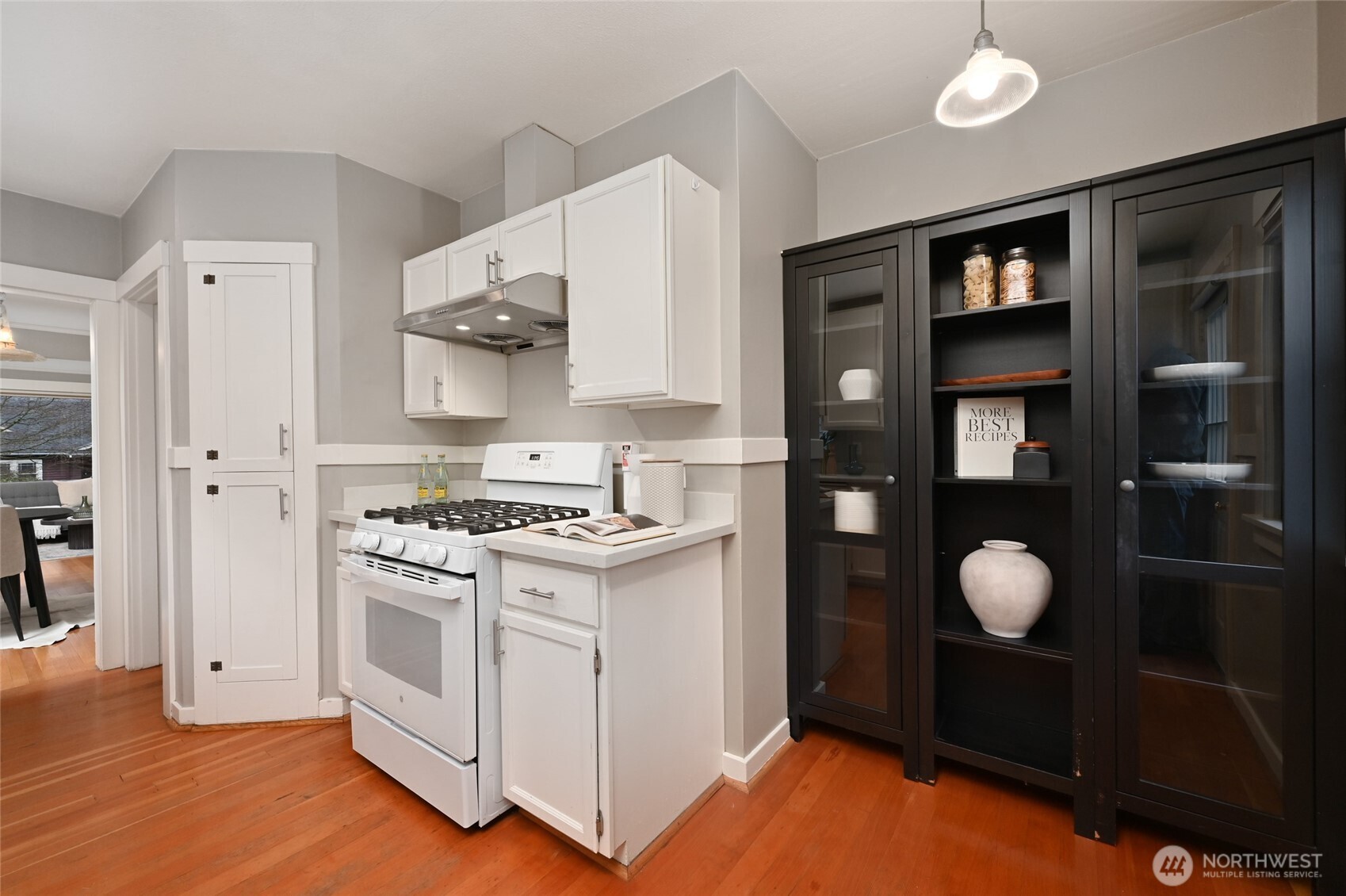 6056 25th Avenue Northeast Seattle, WA 98115 - Photo 12 of 34 a kitchen with stainless steel appliances granite countertop a stove and a refrigerator