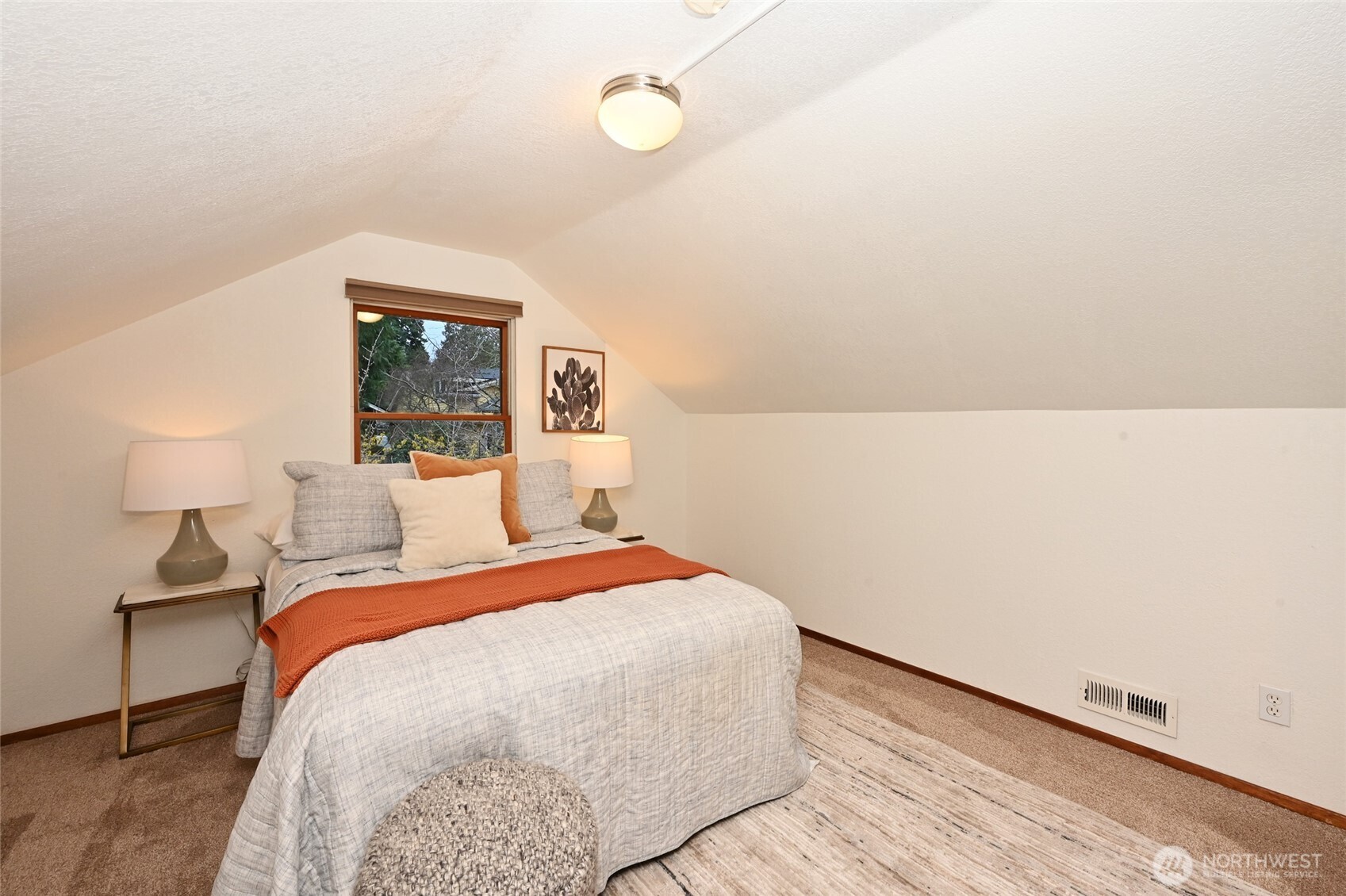 6056 25th Avenue Northeast Seattle, WA 98115 - Photo 19 of 34 a bedroom with a bed and a night stand