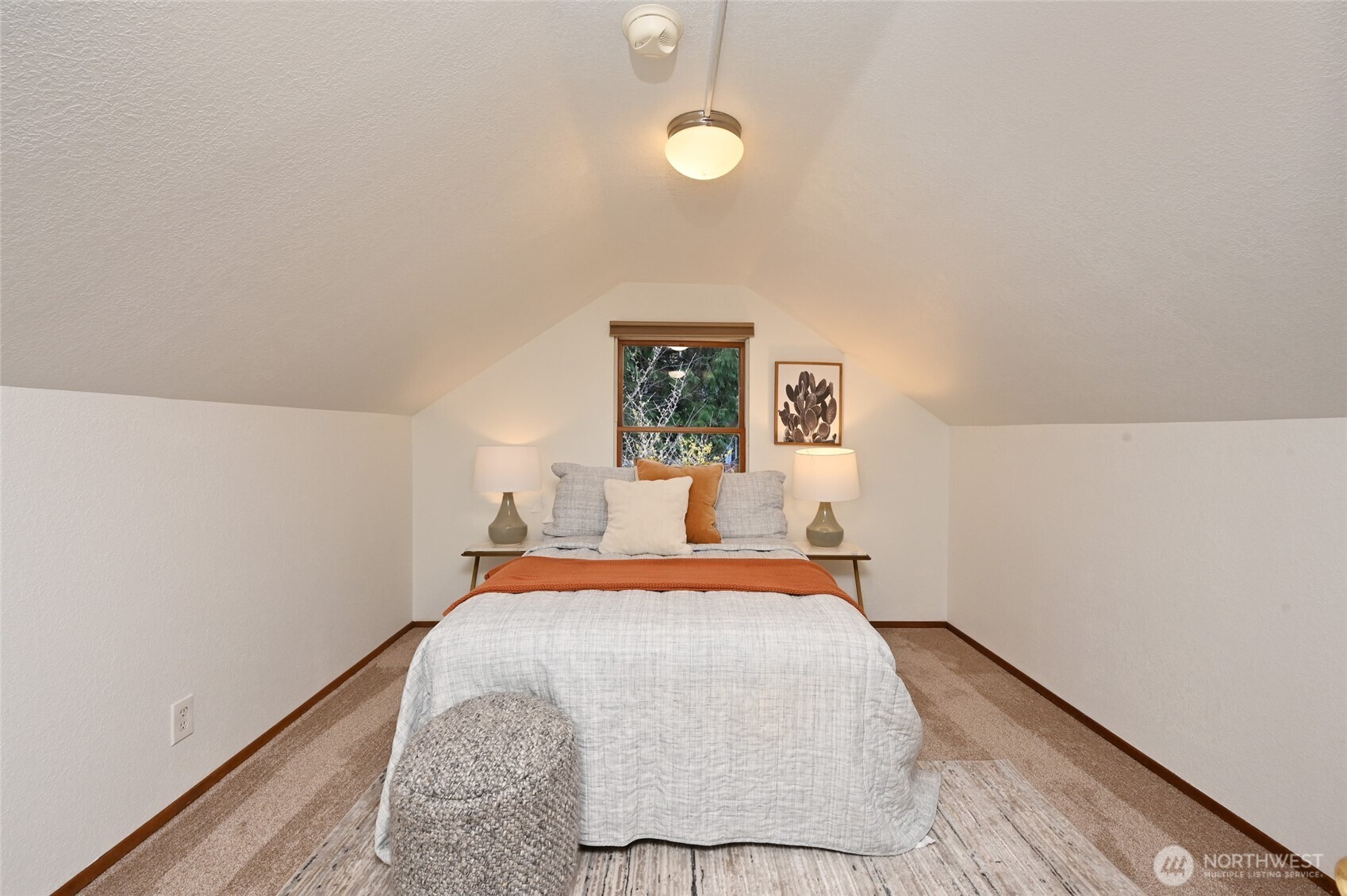 6056 25th Avenue Northeast Seattle, WA 98115 - Photo 20 of 34 a bedroom with a bed and wooden floor