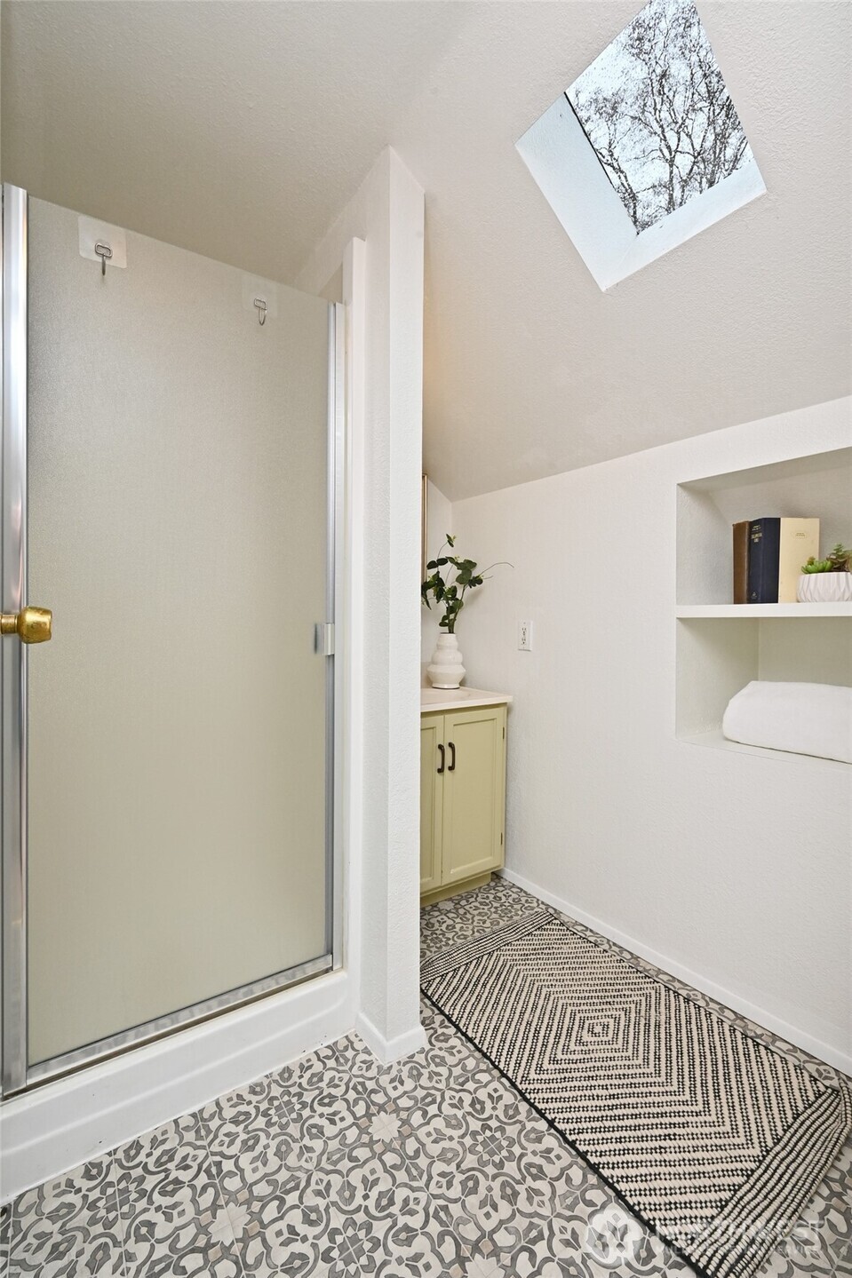 6056 25th Avenue Northeast Seattle, WA 98115 - Photo 23 of 34 a view of a room with wooden floor and cabinet