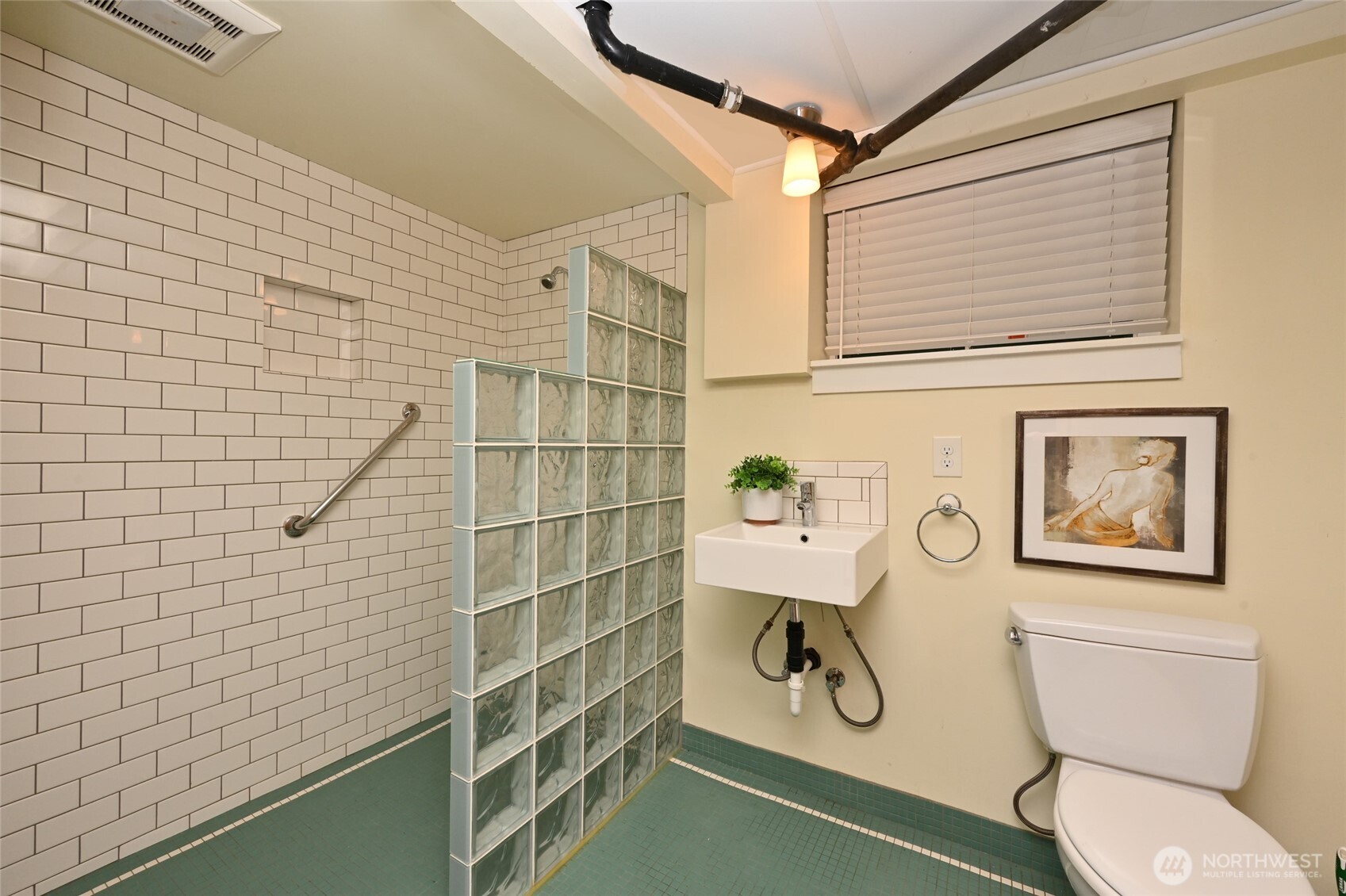 6056 25th Avenue Northeast Seattle, WA 98115 - Photo 27 of 34 a bathroom with a toilet and a shower