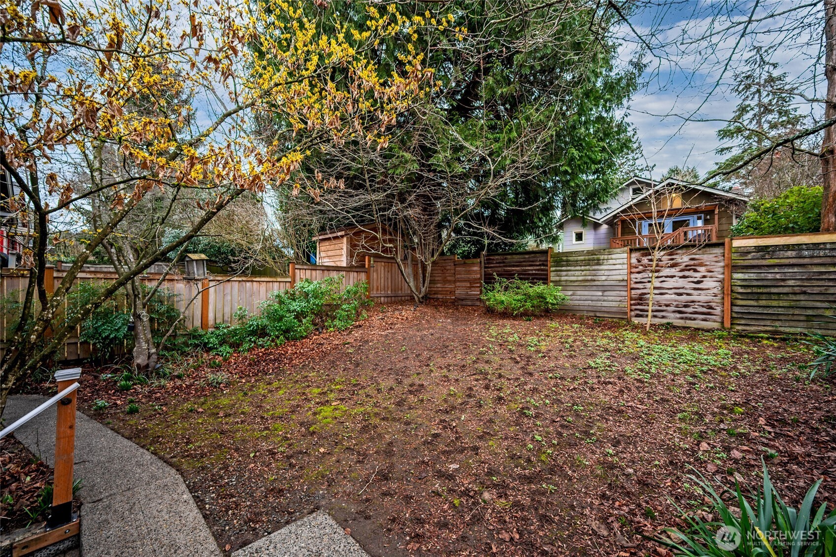 6056 25th Avenue Northeast Seattle, WA 98115 - Photo 34 of 34 a front view of a house with a yard