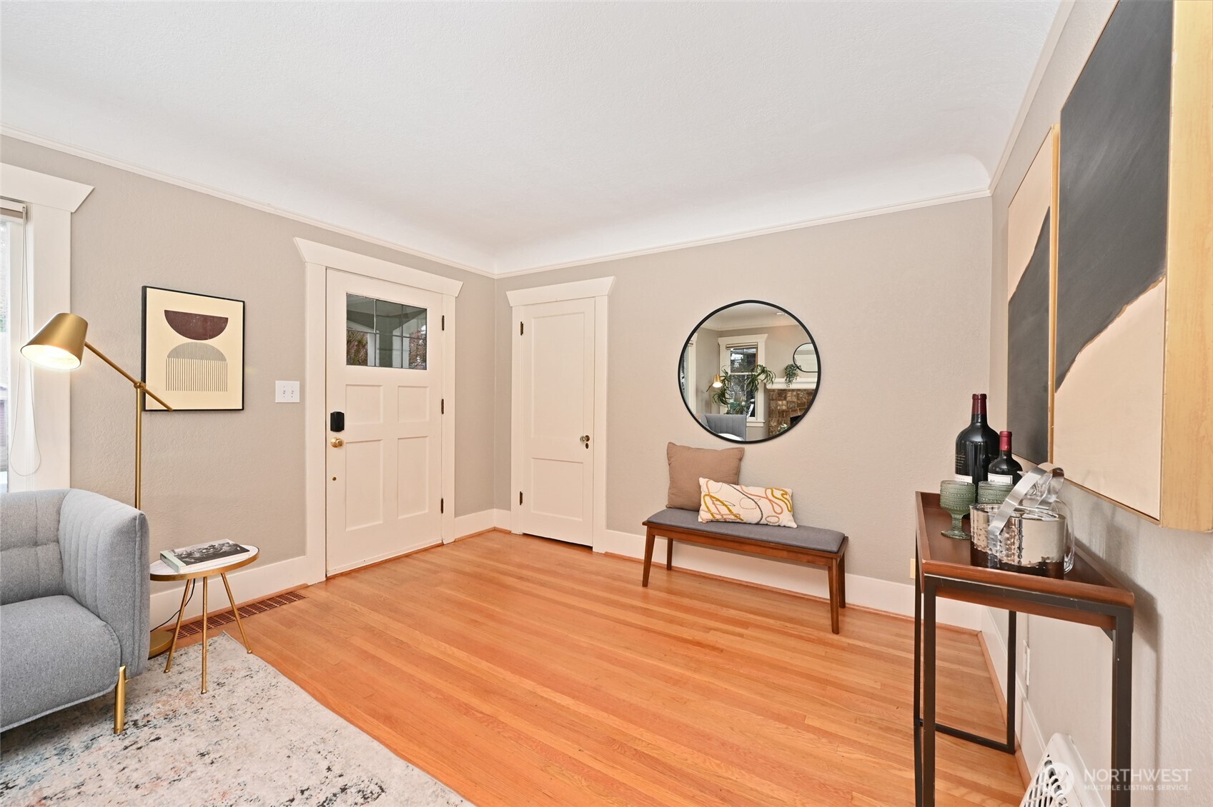 6056 25th Avenue Northeast Seattle, WA 98115 - Photo 5 of 34 a living room with furniture a rug and a wall painting
