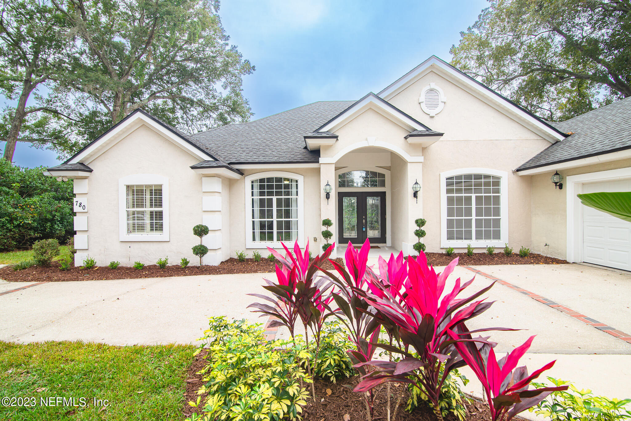 780 Queens Harbor Boulevard Jacksonville, FL 32225 - Photo 1 of 42 a front view of a house with a yard