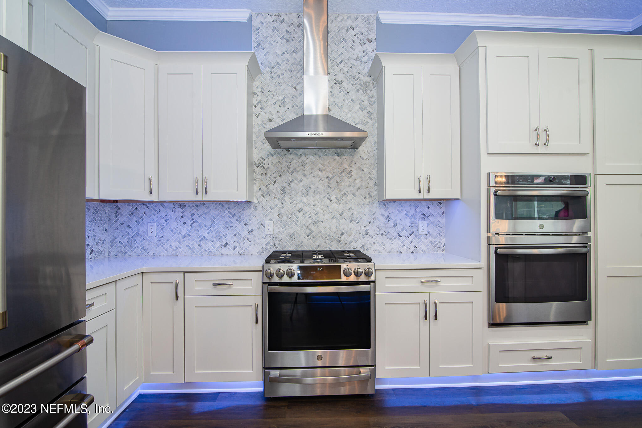 780 Queens Harbor Boulevard Jacksonville, FL 32225 - Photo 16 of 42 a kitchen with granite countertop white cabinets and stainless steel appliances