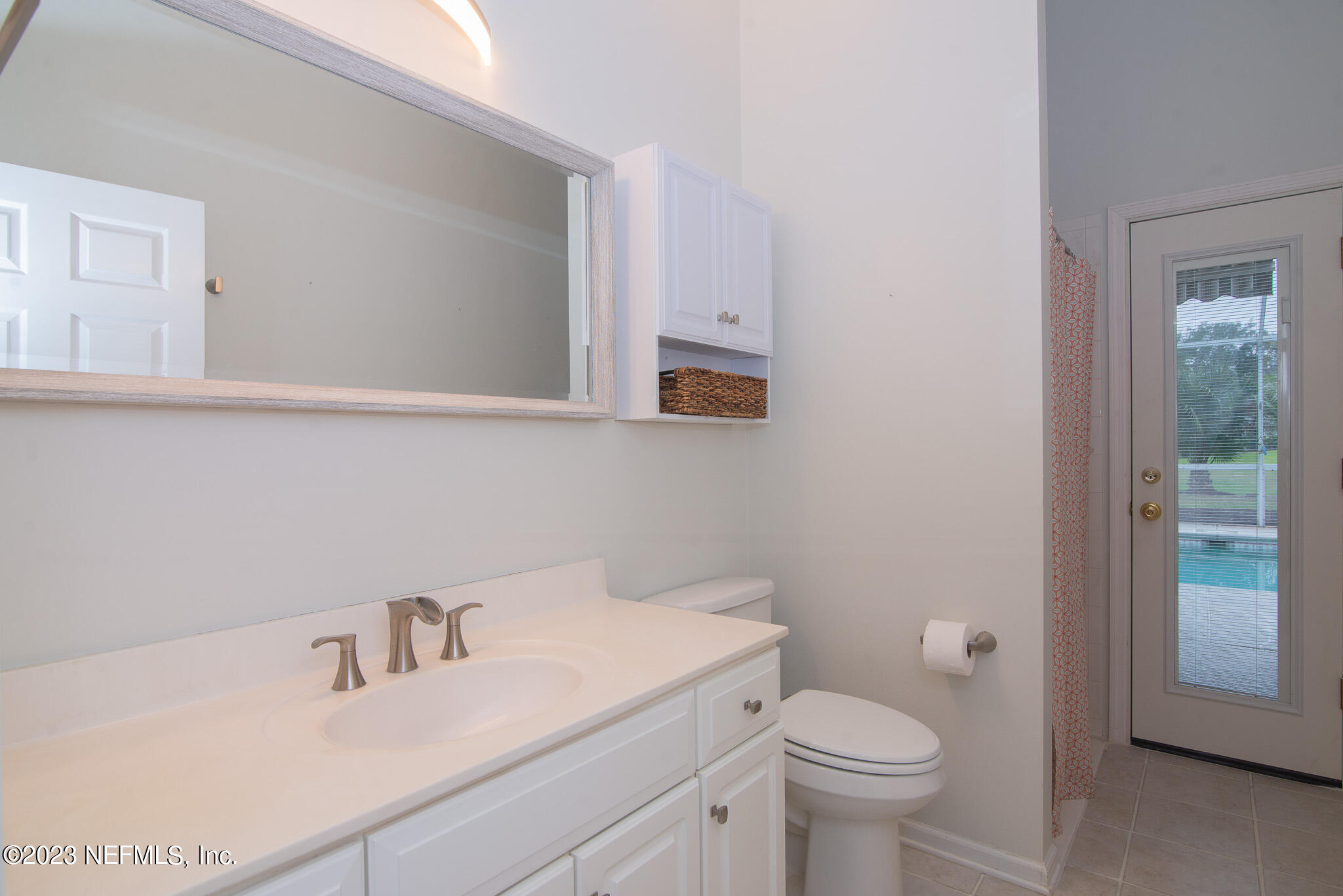 780 Queens Harbor Boulevard Jacksonville, FL 32225 - Photo 28 of 42 a bathroom with a sink toilet and vanity