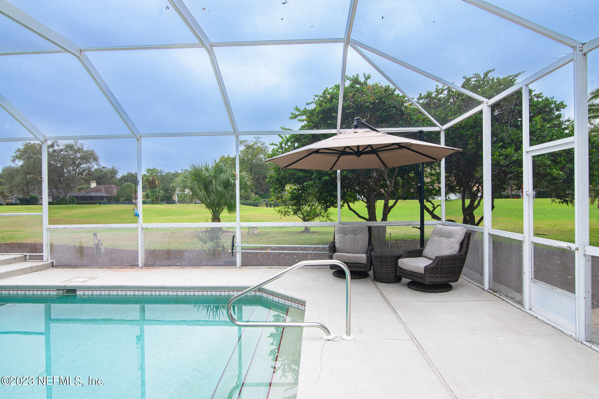 780 Queens Harbor Boulevard Jacksonville, FL 32225 - Photo 34 of 42 a view of a patio with chairs and a potted plant