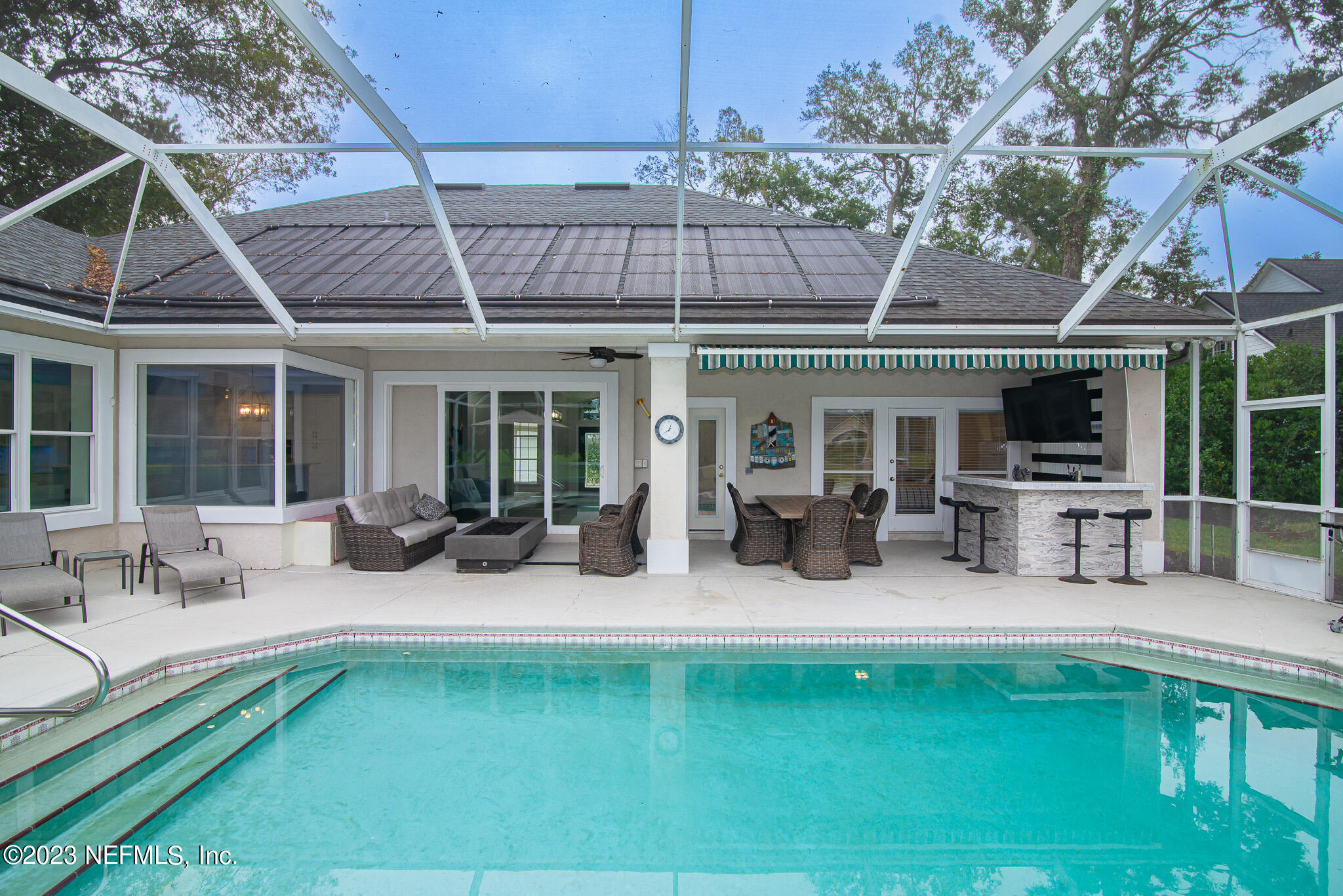 780 Queens Harbor Boulevard Jacksonville, FL 32225 - Photo 37 of 42 a swimming pool with outdoor seating and yard