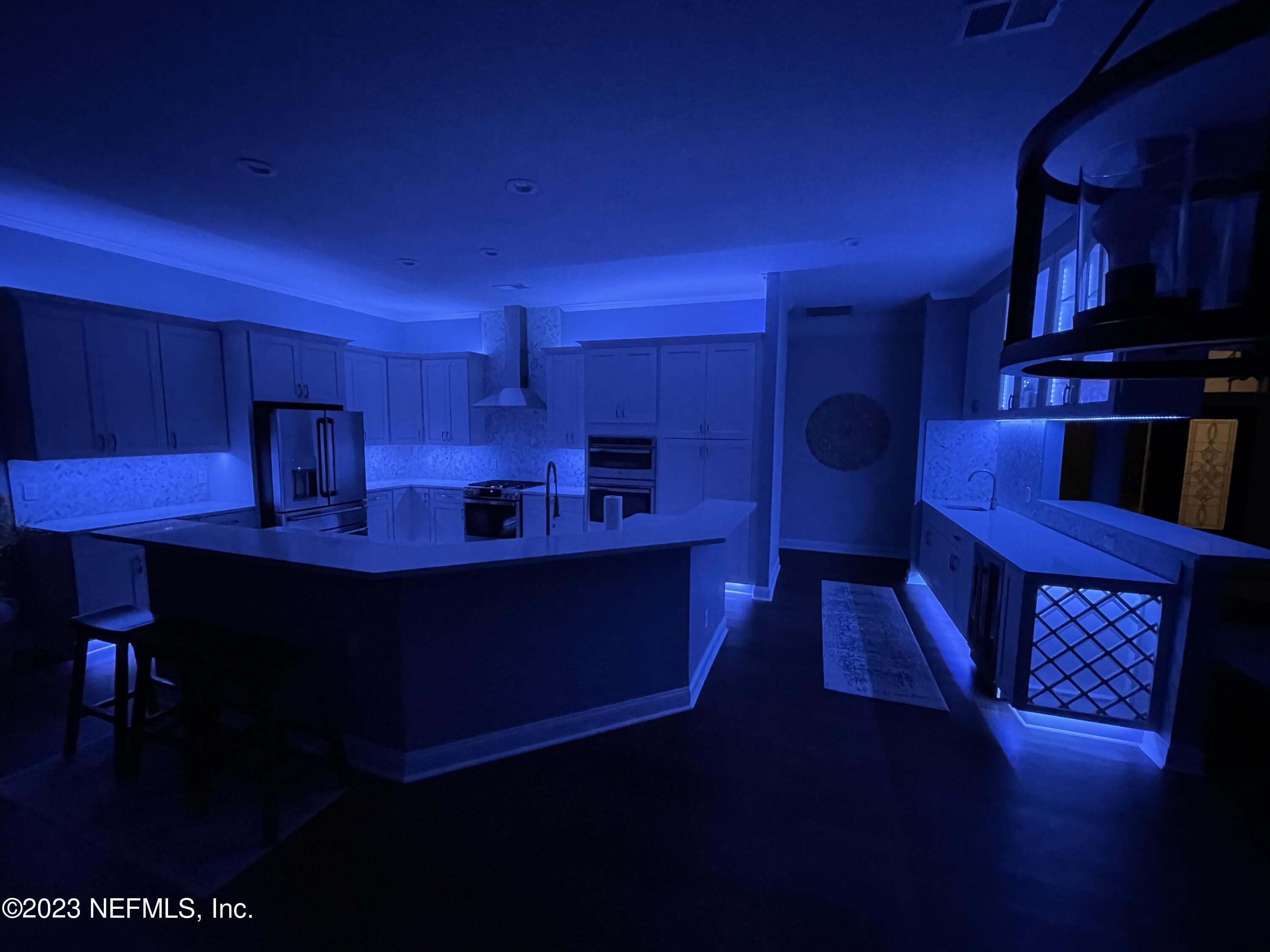 780 Queens Harbor Boulevard Jacksonville, FL 32225 - Photo 41 of 42 a kitchen with wooden cabinets and a sink