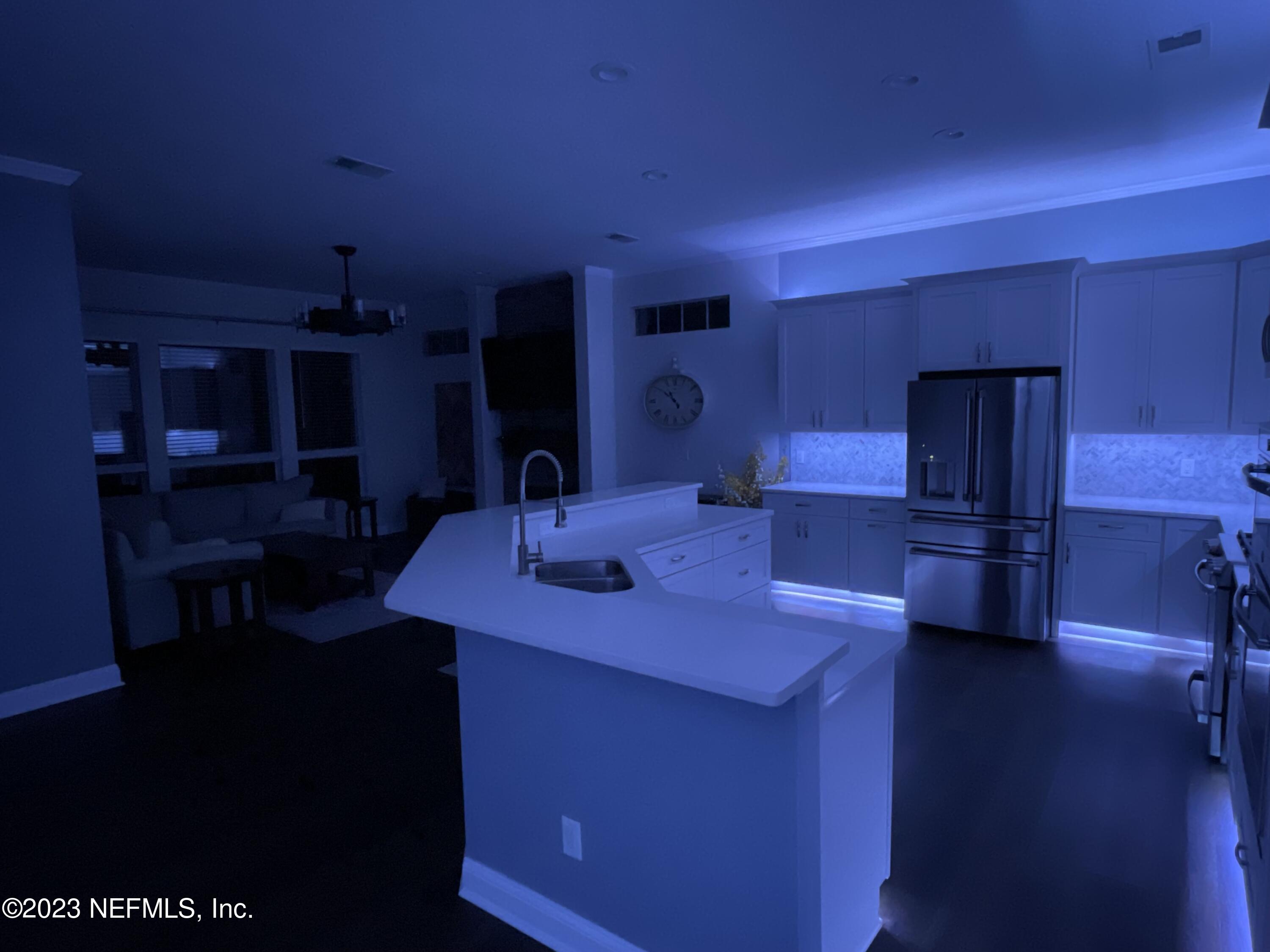 780 Queens Harbor Boulevard Jacksonville, FL 32225 - Photo 42 of 42 a kitchen with kitchen island a sink stove and refrigerator