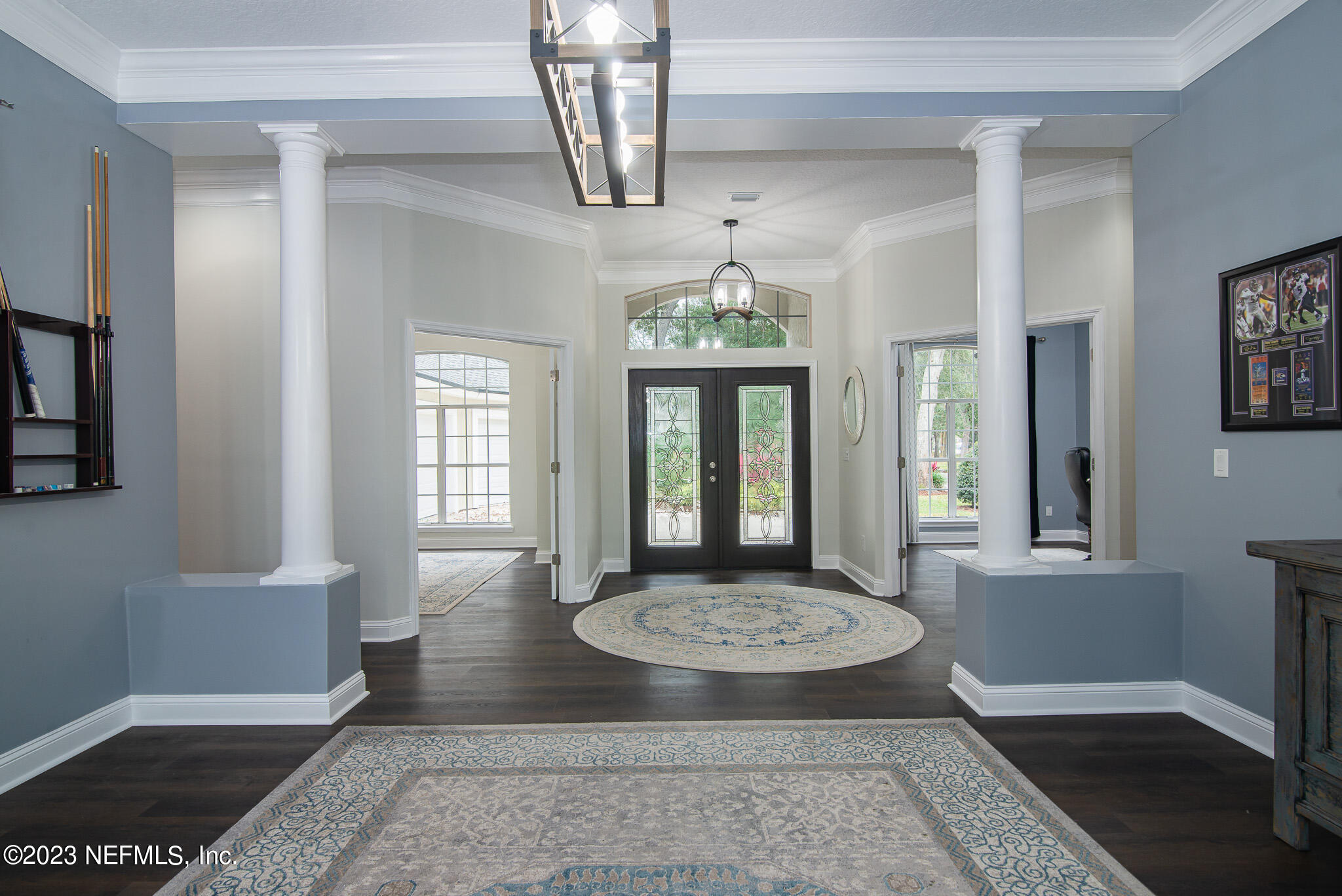 780 Queens Harbor Boulevard Jacksonville, FL 32225 - Photo 7 of 42 a view of a hallway with windows and chandelier