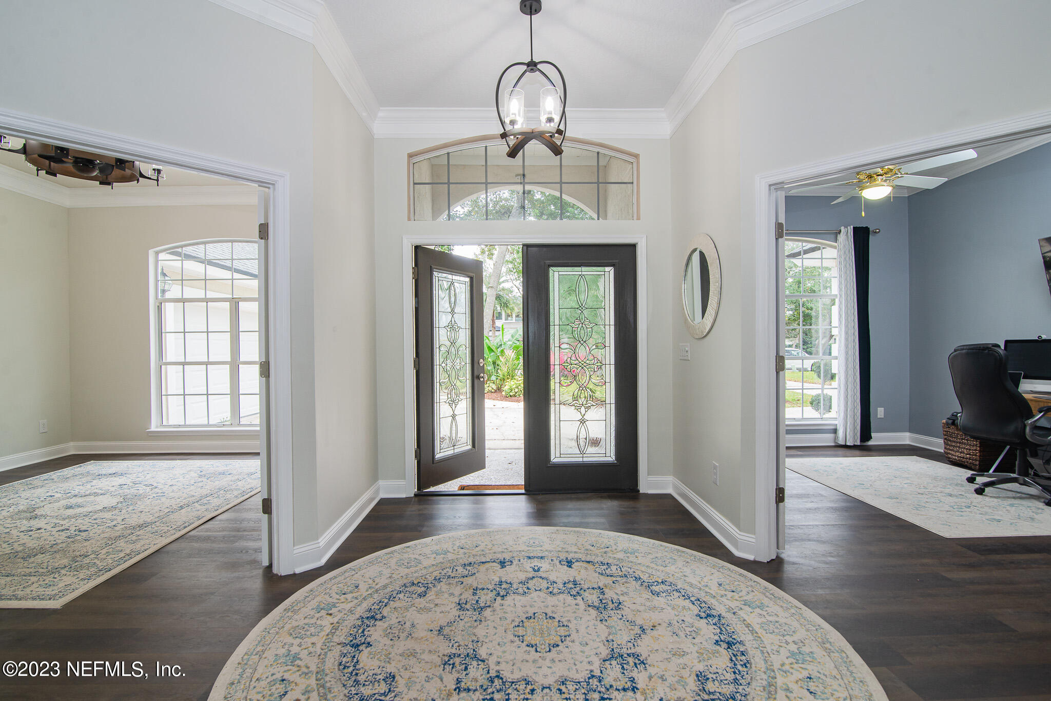 780 Queens Harbor Boulevard Jacksonville, FL 32225 - Photo 8 of 42 a view of an entryway with wooden floor and a chandelier