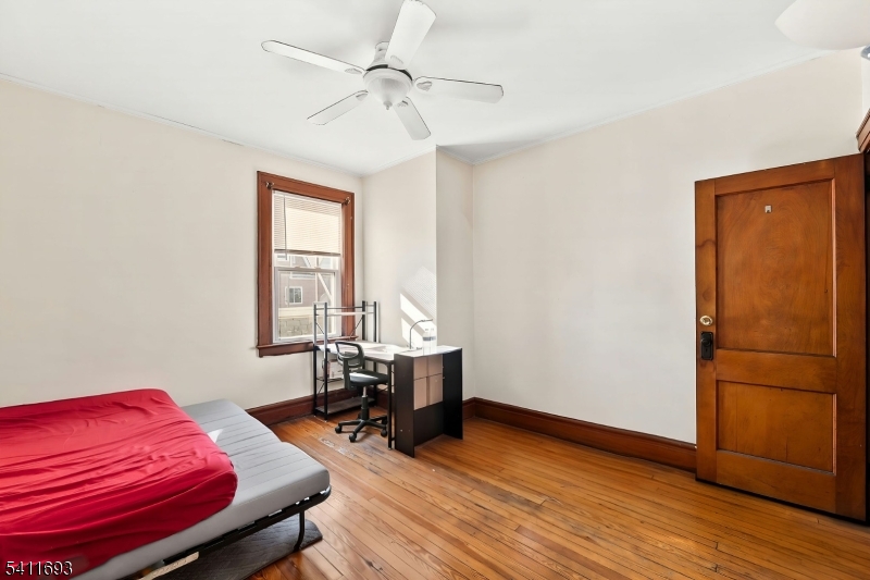 419 Hamilton Street Harrison, NJ 07029 - Photo 15 of 42 a room with furniture and wooden floor